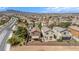 Aerial view of the homes in the neighborhood with desert landscaping and large privacy walls at 1104 Aspen Cliff Dr, Henderson, NV 89011