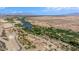 Scenic aerial shot of open desert landscape featuring a winding stream, native vegetation, and a remote, natural environment at 1104 Aspen Cliff Dr, Henderson, NV 89011