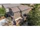 View of the two-story home, patio, and backyard area at 1104 Aspen Cliff Dr, Henderson, NV 89011