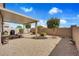 Backyard featuring desert landscaping with a seating area, a built-in grill and a pergola at 1104 Aspen Cliff Dr, Henderson, NV 89011