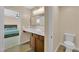 Bathroom with long vanity, with a mirror, and a separate toilet room at 1104 Aspen Cliff Dr, Henderson, NV 89011