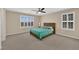Spacious bedroom with large window and ceiling fan, inviting relaxation at 1104 Aspen Cliff Dr, Henderson, NV 89011