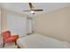 Comfortable bedroom featuring a ceiling fan, a bed, and closet doors at 1104 Aspen Cliff Dr, Henderson, NV 89011