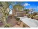 Two-story home with a two-car garage and low maintenance desert landscaping at 1104 Aspen Cliff Dr, Henderson, NV 89011