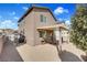 Exterior view of the backyard featuring desert landscaping and a patio at 1104 Aspen Cliff Dr, Henderson, NV 89011
