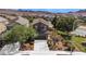 Two-story home with desert landscaping, a driveway, and an attached two-car garage at 1104 Aspen Cliff Dr, Henderson, NV 89011