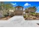 Charming two-story home with a well-maintained front yard and a two-car garage at 1104 Aspen Cliff Dr, Henderson, NV 89011