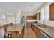 Well-equipped kitchen with granite countertops, stainless steel appliances, and a breakfast bar, perfect for entertaining at 1104 Aspen Cliff Dr, Henderson, NV 89011