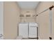 Functional laundry room with a washer and dryer for convenience at 1104 Aspen Cliff Dr, Henderson, NV 89011