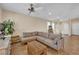 Comfortable living room showcasing a sectional sofa, tile flooring, and stylish accents, ideal for relaxing at 1104 Aspen Cliff Dr, Henderson, NV 89011