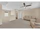 A spacious living room with cozy seating and plenty of natural light at 1104 Aspen Cliff Dr, Henderson, NV 89011
