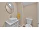 Stylish powder room featuring a modern vanity, vessel sink, and a clean, minimalist design for guests at 1104 Aspen Cliff Dr, Henderson, NV 89011