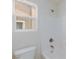 Bright bathroom featuring a white tub, shower, and window for natural light at 11221 Victoria Medici St, Las Vegas, NV 89141