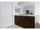Bathroom featuring a dark vanity, tile floors, and a large mirror at 11221 Victoria Medici St, Las Vegas, NV 89141