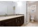 Double sink bathroom vanity with tile backsplash, offering plenty of room, and a separate toilet area at 11221 Victoria Medici St, Las Vegas, NV 89141