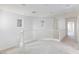 Upstairs landing boasting neutral walls and carpet, accented by a white banister and natural light at 11221 Victoria Medici St, Las Vegas, NV 89141