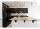 Kitchen features granite countertops, dark cabinets, an island with a sink, and appliances at 11221 Victoria Medici St, Las Vegas, NV 89141
