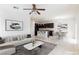 Inviting living room featuring an open floor plan that flows into the kitchen and dining area at 11221 Victoria Medici St, Las Vegas, NV 89141