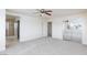 Carpeted main bedroom featuring a ceiling fan, closet, and ensuite bathroom at 11221 Victoria Medici St, Las Vegas, NV 89141