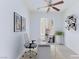 Bright office features a ceiling fan, window, and modern desk, creating an ideal workspace at 11221 Victoria Medici St, Las Vegas, NV 89141