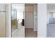 Bright walk-in closet with shelving in a bathroom that features a shower with glass doors, a bath, and a vanity with cabinets at 11221 Victoria Medici St, Las Vegas, NV 89141