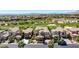Aerial view of a luxury home with lush landscaping in a neighborhood near a golf course at 11503 Glowing Sunset Ln, Las Vegas, NV 89135