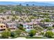 Scenic aerial view of a luxury home with a backyard pool nestled among the community at 11503 Glowing Sunset Ln, Las Vegas, NV 89135