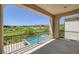 Scenic views of the golf course from the covered outdoor living space with swimming pool at 11503 Glowing Sunset Ln, Las Vegas, NV 89135