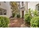 Inviting courtyard showcasing lush greenery, a central tree, and architectural details at 11503 Glowing Sunset Ln, Las Vegas, NV 89135