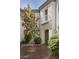 Private courtyard offers lush landscaping, a mature tree, and entry to the residence at 11503 Glowing Sunset Ln, Las Vegas, NV 89135