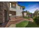 Charming courtyard with artificial turf, decorative brick, and access to the main house at 11503 Glowing Sunset Ln, Las Vegas, NV 89135