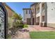 Spacious courtyard with artificial turf, a gated entrance, and custom landscaping at 11503 Glowing Sunset Ln, Las Vegas, NV 89135