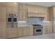 Gourmet kitchen features stainless steel Viking appliances and custom cabinetry at 11503 Glowing Sunset Ln, Las Vegas, NV 89135