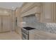 Well-equipped kitchen features stainless steel appliances, custom cabinetry, and a modern range hood at 11503 Glowing Sunset Ln, Las Vegas, NV 89135