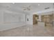 Open kitchen area with stainless steel appliances, tile floors, and natural light at 11503 Glowing Sunset Ln, Las Vegas, NV 89135