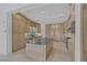 Kitchen features a large island, stainless steel appliances, and custom cabinetry at 11503 Glowing Sunset Ln, Las Vegas, NV 89135