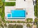 Aerial view showcasing a backyard pool, spa, lounge area, and modern patio at 11503 Glowing Sunset Ln, Las Vegas, NV 89135