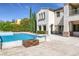 Inviting backyard pool and patio area with outdoor fire pit, perfect for enjoying warm evenings at 11503 Glowing Sunset Ln, Las Vegas, NV 89135
