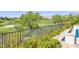 Picturesque view of a lush golf course, mature trees, and desert landscape from the backyard at 11503 Glowing Sunset Ln, Las Vegas, NV 89135