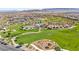 Aerial view of the community park featuring a playground, walking paths, and green spaces at 11847 Corenzio Ave, Las Vegas, NV 89138