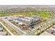 Expansive aerial view of a community and school showcasing the neighborhood's layout and nearby amenities at 11847 Corenzio Ave, Las Vegas, NV 89138