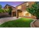 Expansive backyard features artificial turf and covered patio, perfect for outdoor entertaining at 11847 Corenzio Ave, Las Vegas, NV 89138