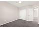 Neutral bedroom features gray carpet, ceiling fan, and closet for a clean and comfortable design at 11847 Corenzio Ave, Las Vegas, NV 89138