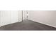Neutral bedroom features gray carpet, closet, and leads to the bathroom for convenience at 11847 Corenzio Ave, Las Vegas, NV 89138