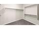 Walk-in closet featuring carpet and multiple levels of metal storage shelves at 11847 Corenzio Ave, Las Vegas, NV 89138