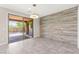 A dining room with a decorative wall and sliding door to the backyard at 11847 Corenzio Ave, Las Vegas, NV 89138