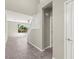 Bright hallway with tile flooring and a view into the living room at 11847 Corenzio Ave, Las Vegas, NV 89138