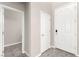 Hallway featuring neutral walls, tile floors, and doors to other rooms at 11847 Corenzio Ave, Las Vegas, NV 89138