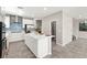 Bright kitchen with white cabinets, stainless steel appliances, an island, and modern finishes at 11847 Corenzio Ave, Las Vegas, NV 89138