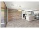 Bright kitchen with stainless steel appliances, island and an adjacent dining area at 11847 Corenzio Ave, Las Vegas, NV 89138